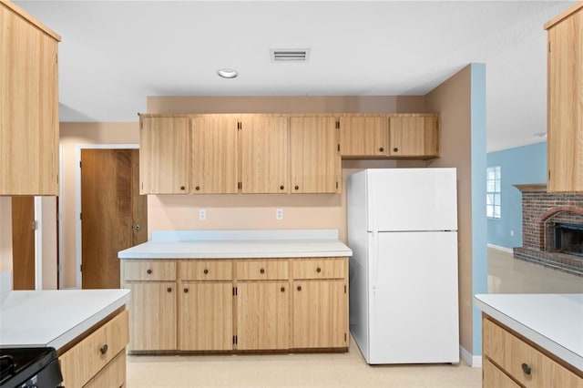 kitchen featuring black electric range, light brown cabinetry, a fireplace, lofted ceiling, and white refrigerator