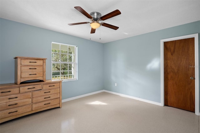 unfurnished bedroom featuring ceiling fan