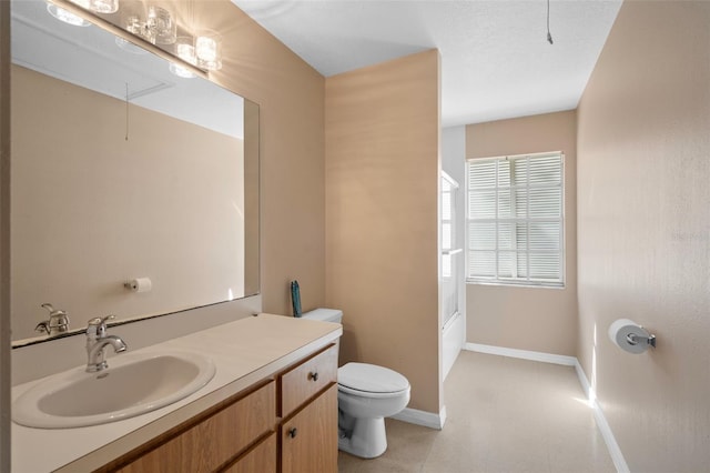 bathroom with toilet and vanity