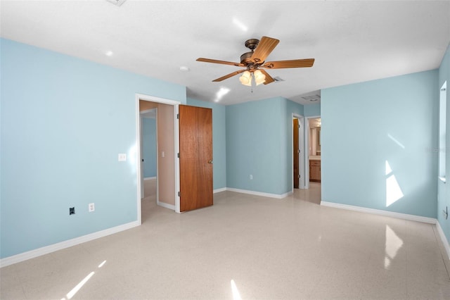 unfurnished bedroom featuring ensuite bathroom and ceiling fan