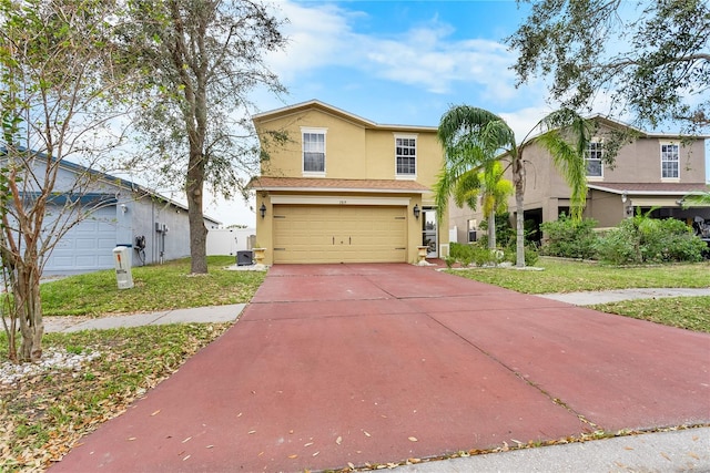 view of front facade featuring a garage and a front yard