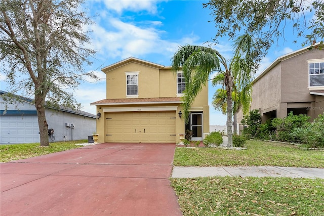 view of front facade with a garage and a front lawn