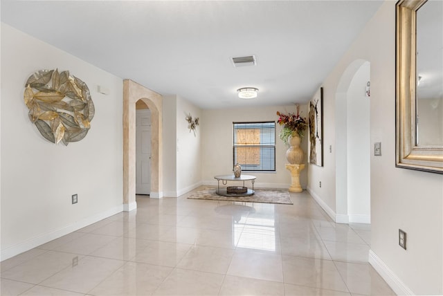 unfurnished room featuring light tile patterned floors