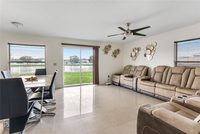 living room featuring ceiling fan and light tile patterned flooring