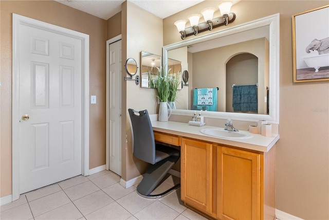 bathroom featuring vanity and tile patterned flooring