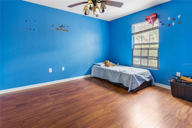 bedroom featuring wood-type flooring and ceiling fan