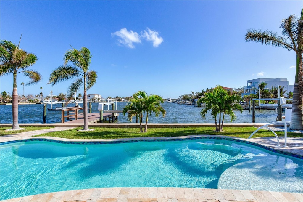 view of pool featuring a dock and a water view