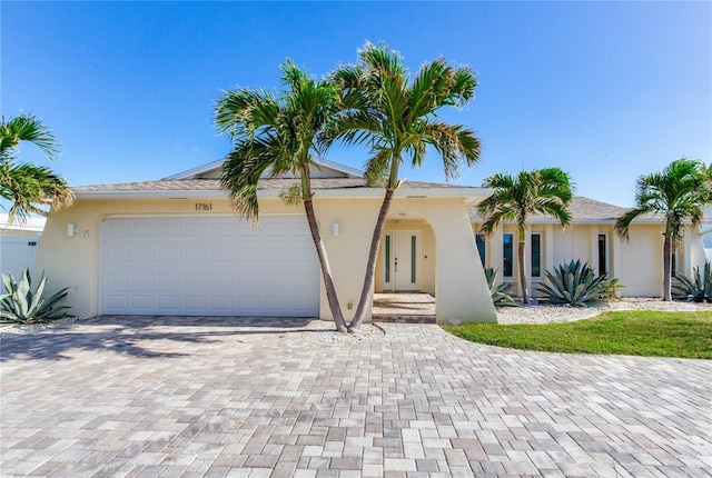 single story home with a garage