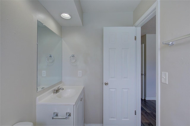 bathroom featuring vanity and hardwood / wood-style flooring