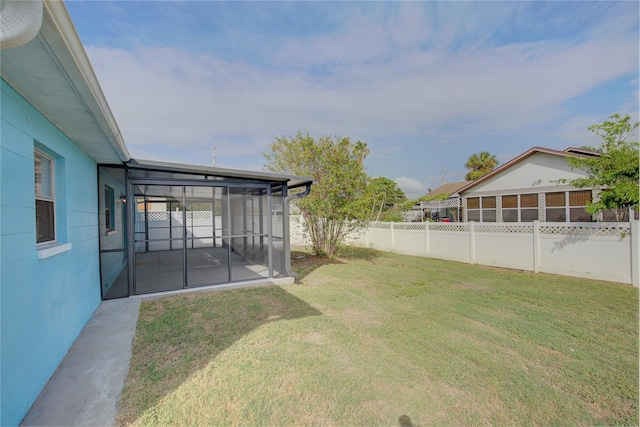 view of yard featuring a sunroom