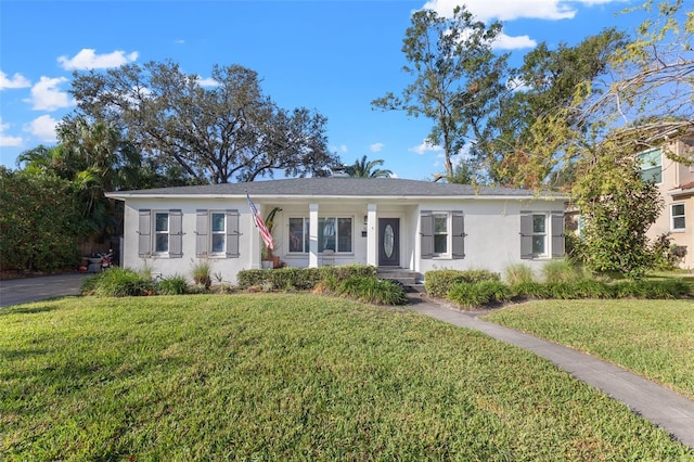 ranch-style house with a front lawn