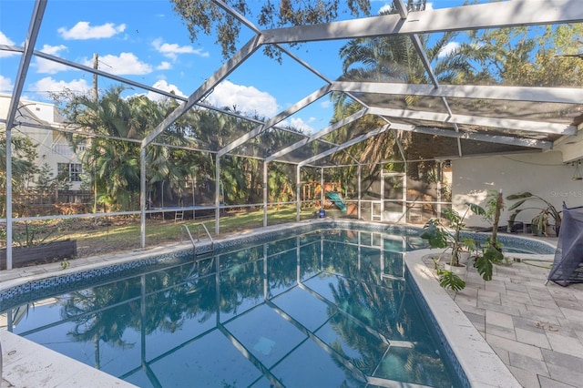 view of pool featuring a lanai and a patio