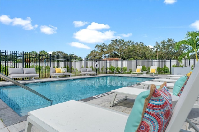 view of swimming pool featuring a patio area