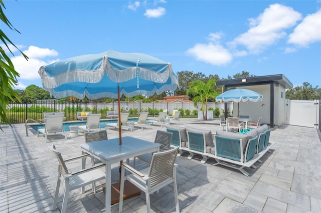 view of patio with a fenced in pool and a mountain view