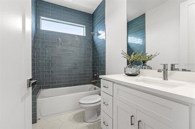 full bathroom featuring vanity, toilet, tile patterned flooring, and tiled shower / bath