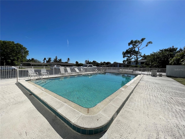 view of swimming pool featuring a patio