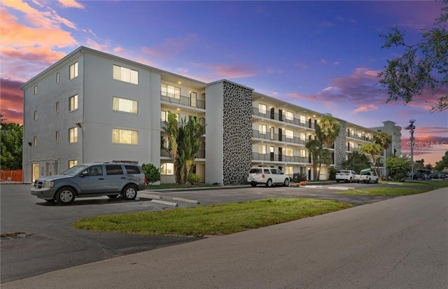 view of outdoor building at dusk