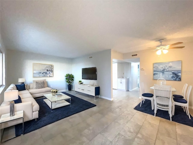 living room with ceiling fan