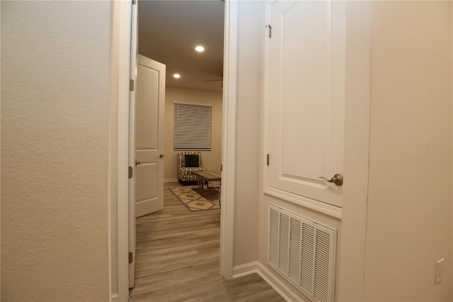 corridor with wood-type flooring