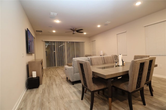 dining room featuring light wood-type flooring and ceiling fan