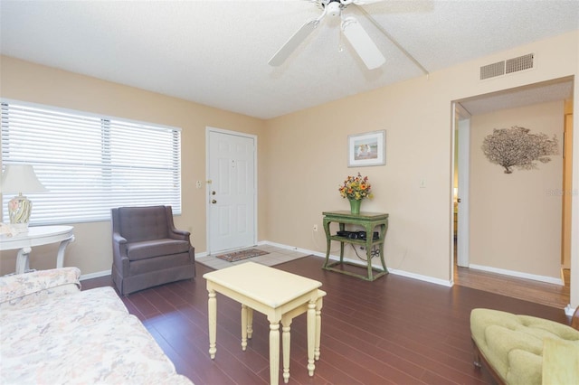 315 30th Ave W Unit B201, Bradenton, FL 34205 - living area featuring ceiling fan, dark wood-style floors, and baseboards