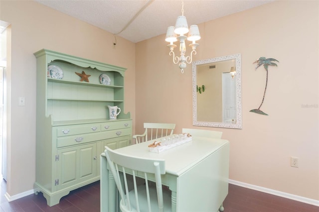 315 30th Ave W Unit B201, Bradenton, FL 34205 - dining room with baseboards, dark wood-style floors, and a chandelier