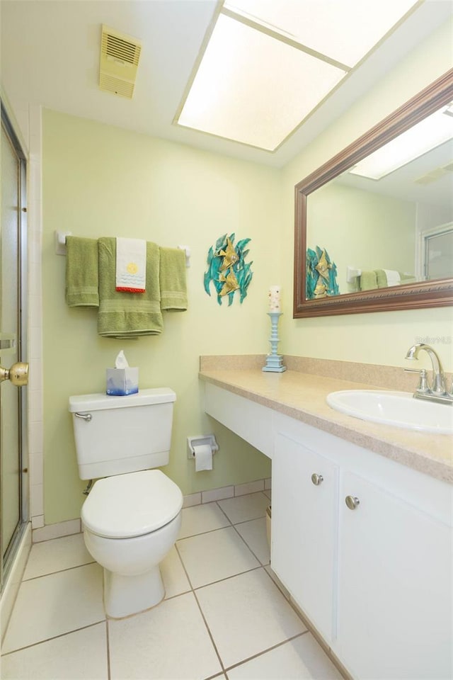 315 30th Ave W Unit B201, Bradenton, FL 34205 - full bathroom featuring toilet, vanity, a stall shower, and tile patterned flooring