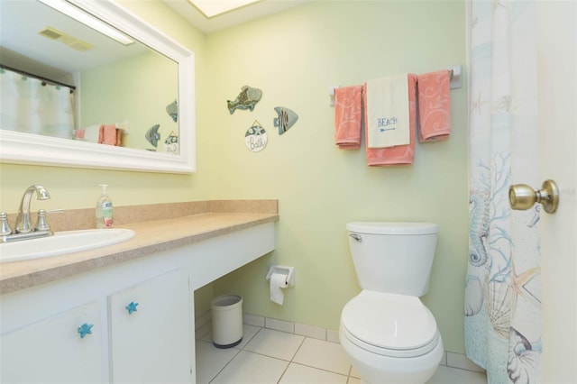 315 30th Ave W Unit B201, Bradenton, FL 34205 - bathroom with vanity, tile patterned flooring, toilet, and baseboards