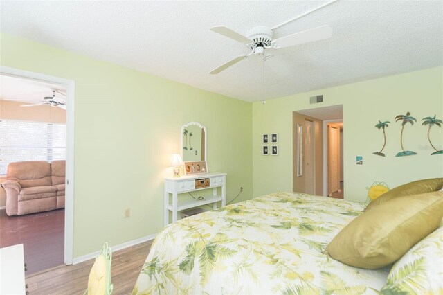 315 30th Ave W Unit B201, Bradenton, FL 34205 - bedroom featuring wood finished floors, baseboards, and ceiling fan