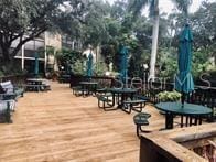 315 30th Ave W Unit B201, Bradenton, FL 34205 - surrounding community with a deck and outdoor dining area