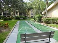 315 30th Ave W Unit B201, Bradenton, FL 34205 - view of home's community featuring shuffleboard and a yard