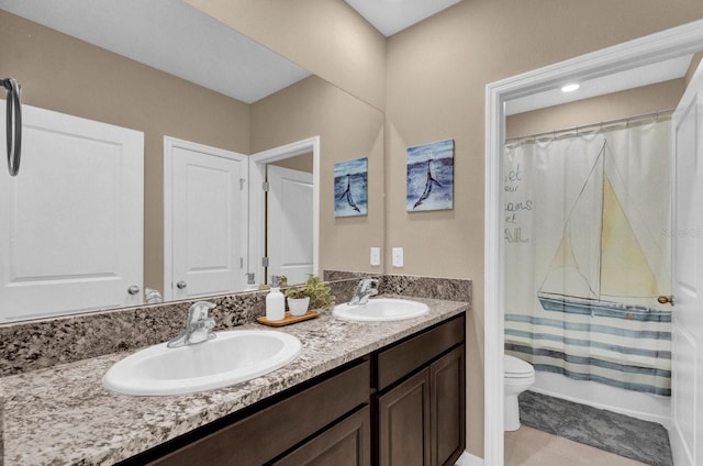 full bathroom featuring toilet, shower / bath combo with shower curtain, vanity, and tile patterned flooring