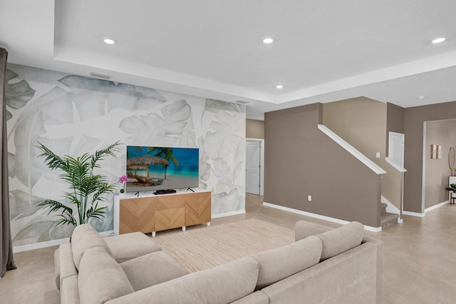 living room with a raised ceiling