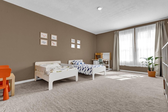 carpeted bedroom with a textured ceiling