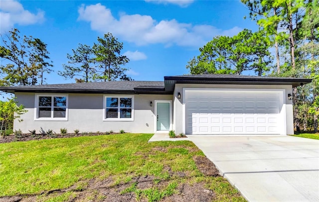 ranch-style house featuring a front yard and a garage