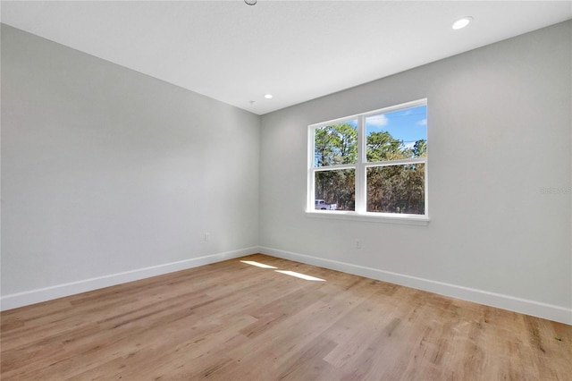 unfurnished room featuring light hardwood / wood-style flooring