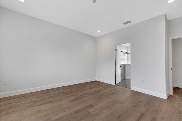 unfurnished bedroom featuring hardwood / wood-style flooring