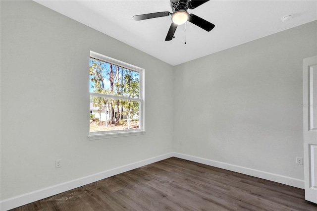 unfurnished room featuring dark hardwood / wood-style floors and ceiling fan