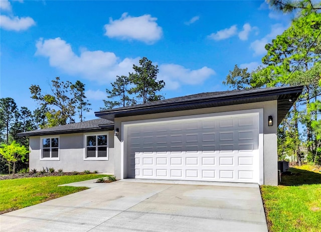 single story home featuring a front yard and a garage