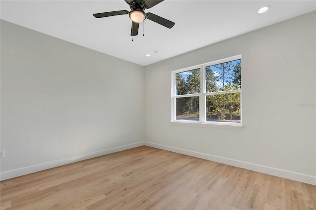 unfurnished room featuring light hardwood / wood-style flooring and ceiling fan