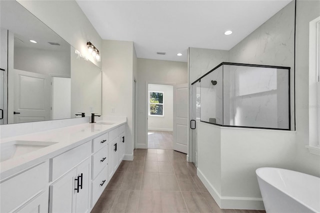 bathroom featuring vanity, separate shower and tub, and tile patterned flooring