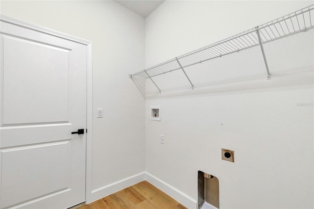 laundry room featuring hardwood / wood-style floors, electric dryer hookup, and washer hookup