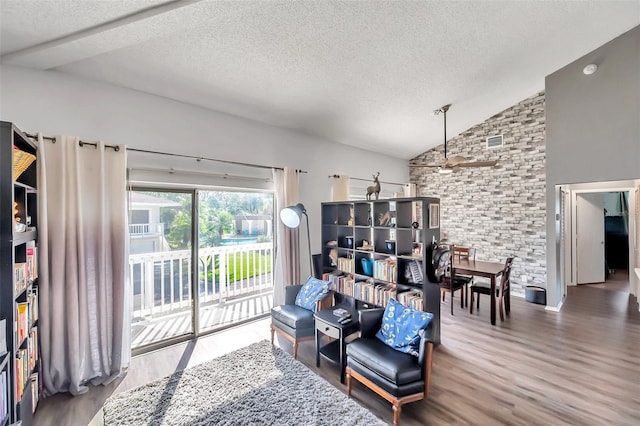 2937 Bough Ave Unit D, Clearwater, FL 33760 - sitting room with a textured ceiling, lofted ceiling, and wood finished floors