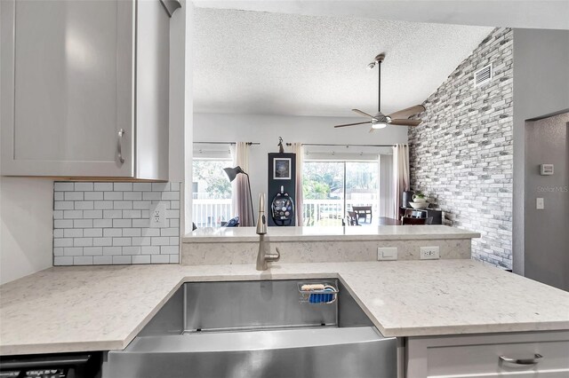 2937 Bough Ave Unit D, Clearwater, FL 33760 - kitchen featuring tasteful backsplash, a sink, a ceiling fan, a textured ceiling, and gray cabinets