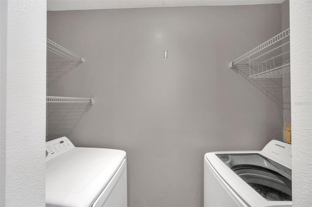 laundry area featuring washing machine and dryer