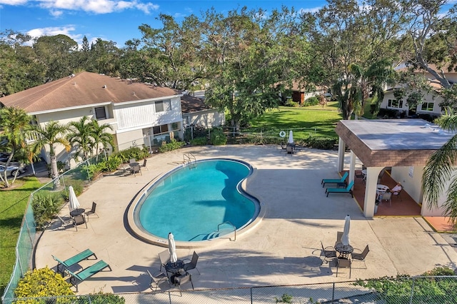 view of swimming pool featuring a patio