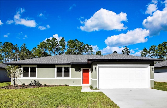 single story home with a garage and a front lawn