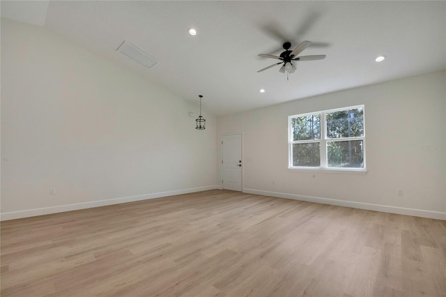 unfurnished room featuring vaulted ceiling, light wood-type flooring, and ceiling fan