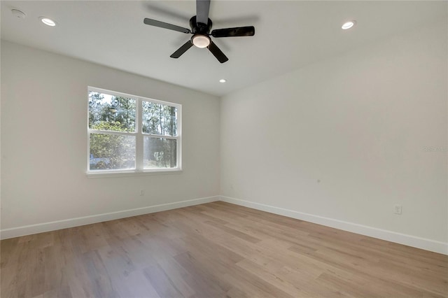 unfurnished room featuring light wood-type flooring and ceiling fan