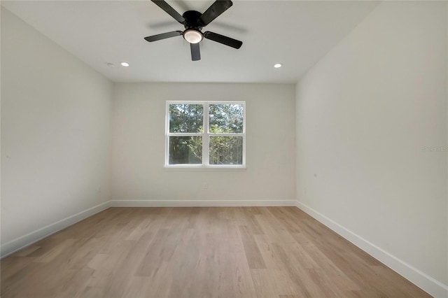 empty room with light wood-type flooring and ceiling fan